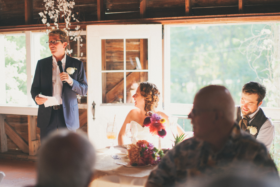 The father of the bride makes a toast at the Blue Dress Barn in Benton Harbor photographed by Ann Arbor Michigan wedding photographer Heather Jowett.