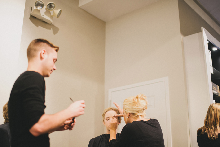 A bride gets her makeup done at Salon Vox in Ann Arbor by Wedding Photographer Heather Jowett.