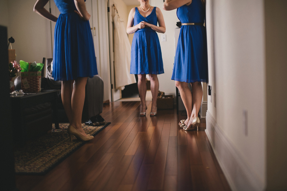 Bridesmaids get dressed at a private home in Ann Arbor, shot by wedding photographer Heather Jowett