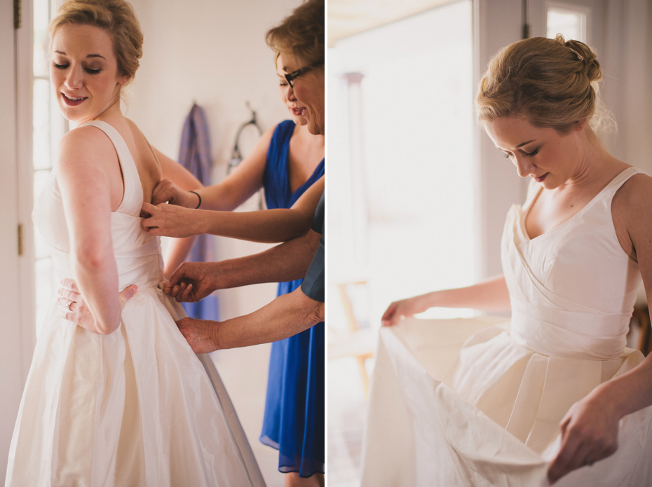 A mother helps a bride into her dress at a private home in Ann Arbor, shot by wedding photographer Heather Jowett