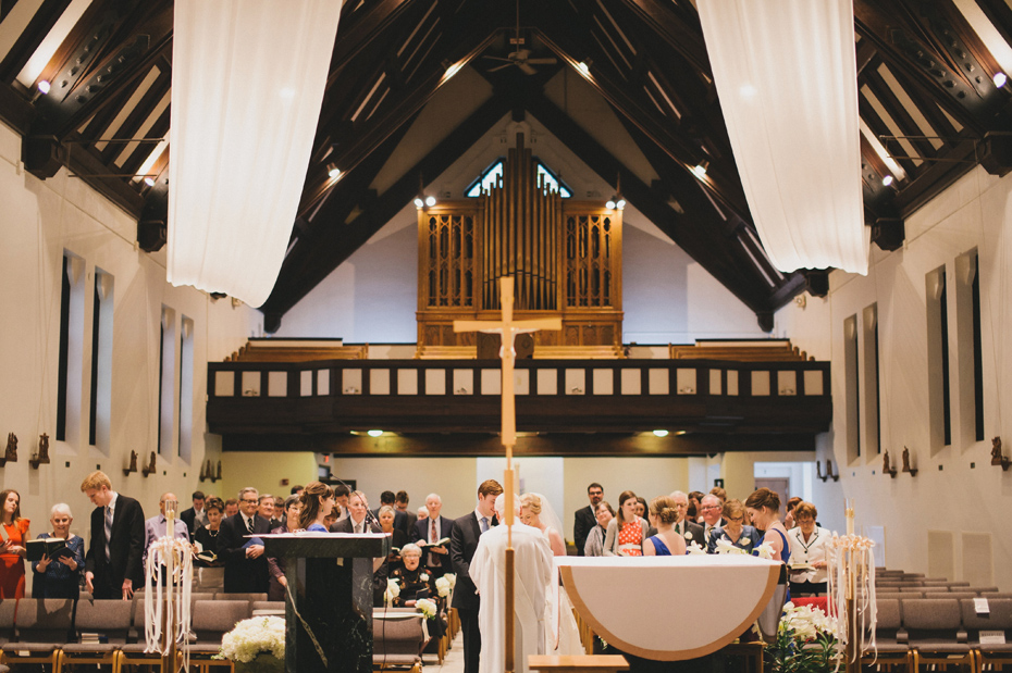 A bride and groom during their wedding at Saint Mary's Student Parish in Ann Arbor, shot by wedding photographer Heather Jowett