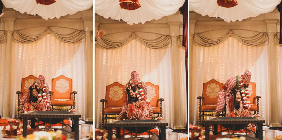 The groom lifts his bride, in a traditional Nepali Hindu wedding ceremony.