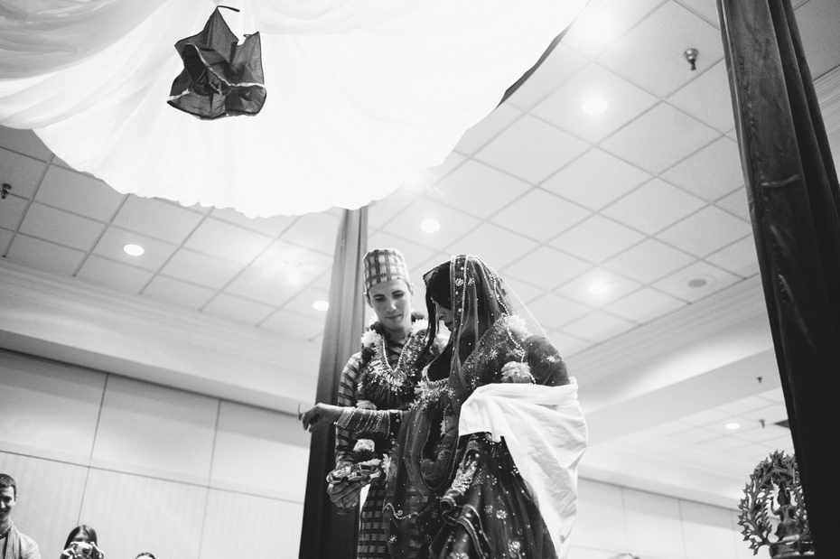 The bride and groom circle the mandap or altar during a traditional Nepali Hindu wedding ceremony.