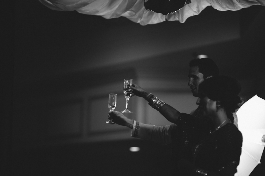 The bride and groom toasts their guests at the wedding reception.