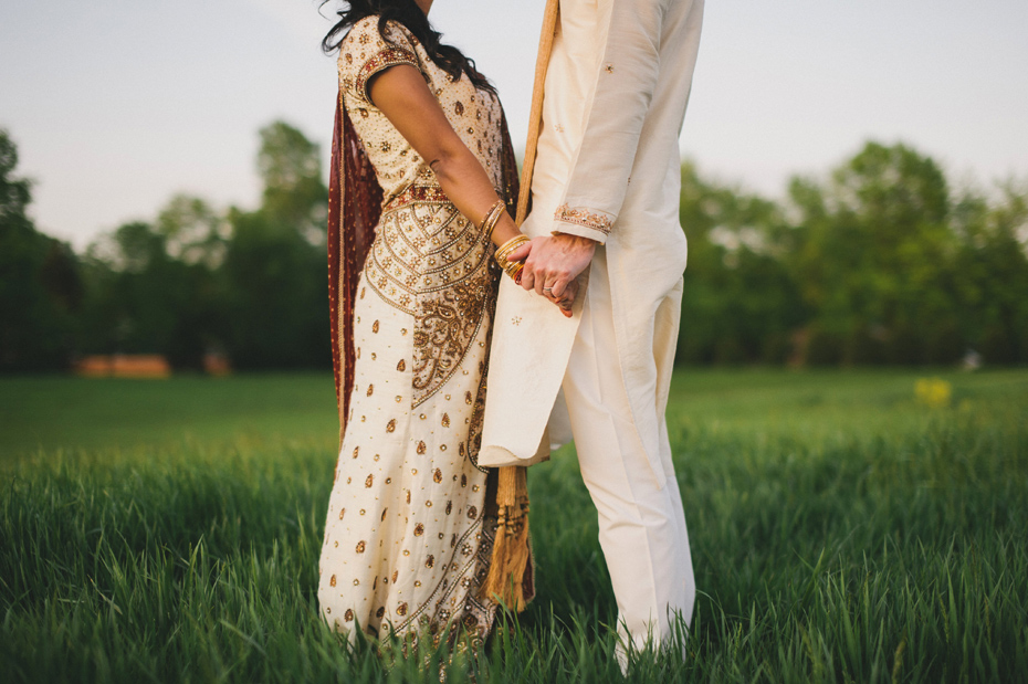 Portraits of a bride and groom in traditional Nepali hindu wedding clothing, by Ann Arbor wedding photographer Heather Jowett.