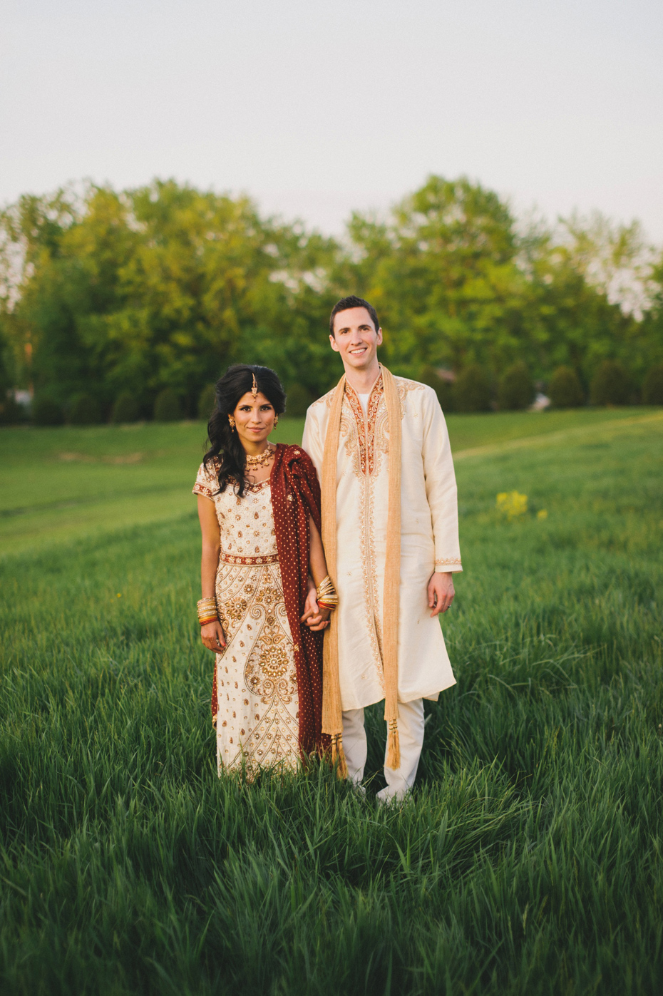 Portraits of a bride and groom in traditional indian wedding clothing, by Ann Arbor wedding photographer Heather Jowett.