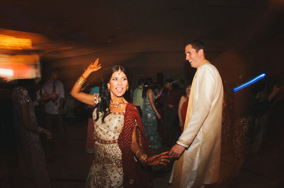 A bride and groom dance at a hindu wedding reception, by Ann Arbor wedding photographer Heather Jowett.