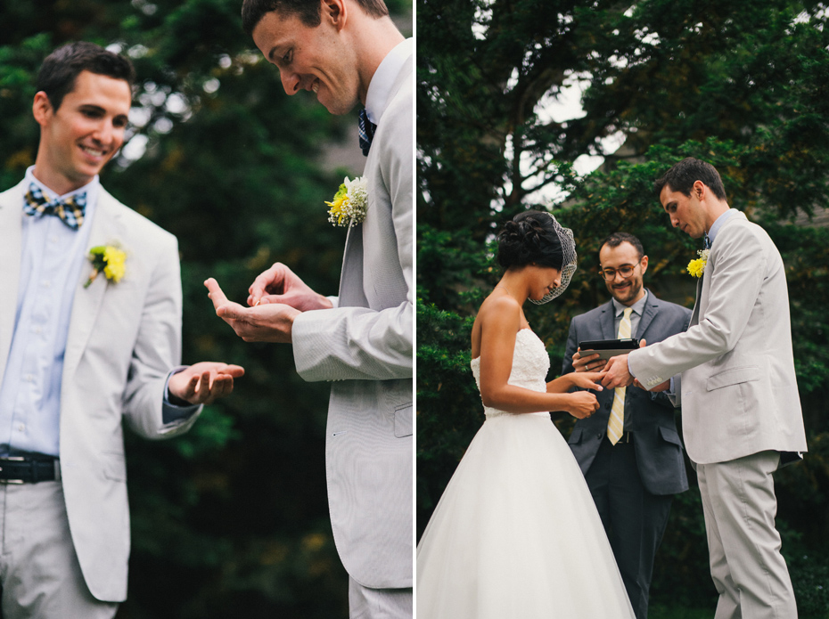 The bride and groom exchange rings in a backyard wedding ceremony, by Ann Arbor wedding photographer Heather Jowett.