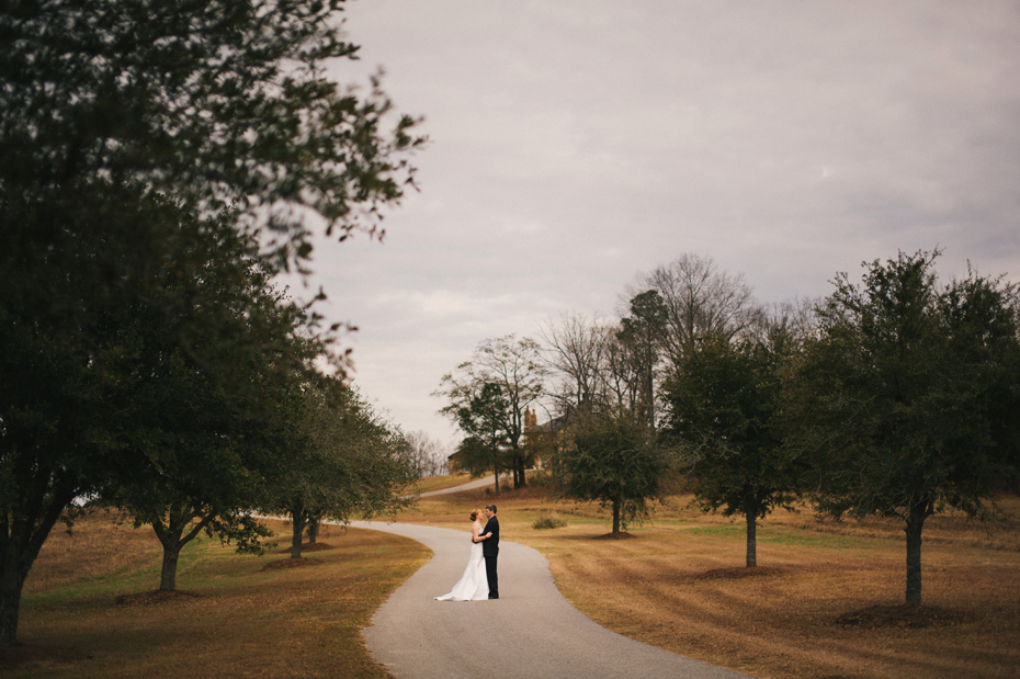 A bride and groom share a private moment together for portraits before their wedding ceremony at the Fountainview mansion, photographed by Ann Arbor Wedding Photographer Heather Jowett.