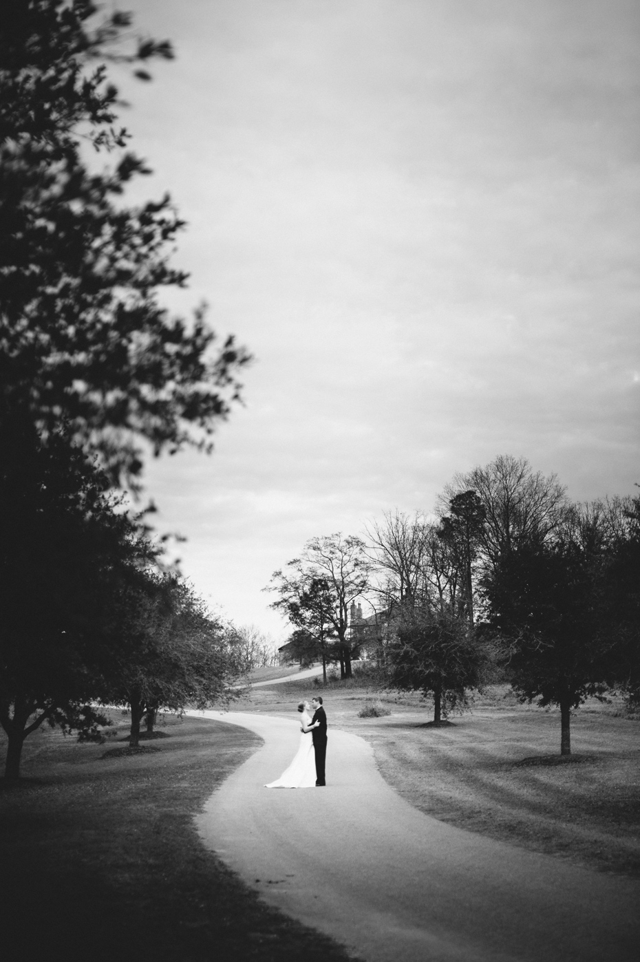 A bride and groom share a private moment together for portraits before their wedding ceremony at the Fountainview mansion, photographed by Michigan Wedding Photographer Heather Jowett.