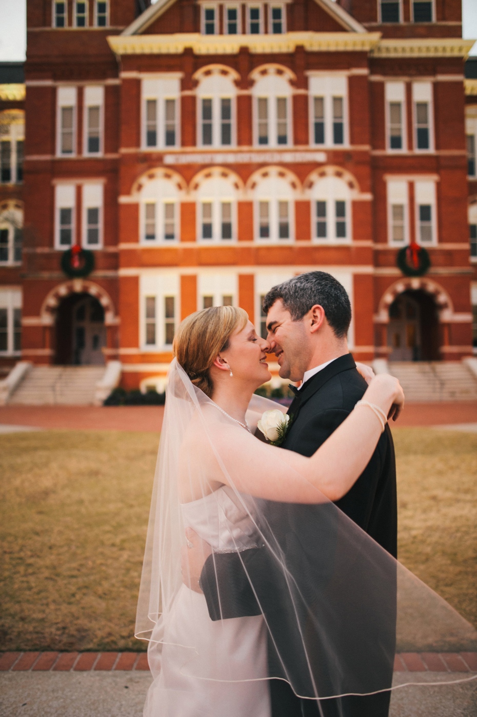 A bride and groom pose outside of Samford Hall in Auburn Alabama, photographed by Ann Arbor Wedding Photographer Heather Jowett.