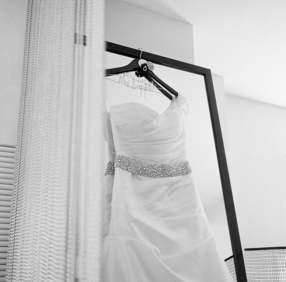 A bride's dress waits to be worn in Chicago, photographed by Ann Arbor Wedding Photographer, Heather Jowett.