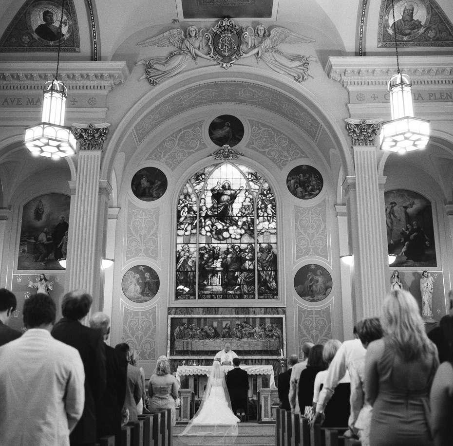 Black and white film images of a catholic wedding mass, photographed by Ann Arbor Wedding Photographer, Heather Jowett on a Rolleiflex T.