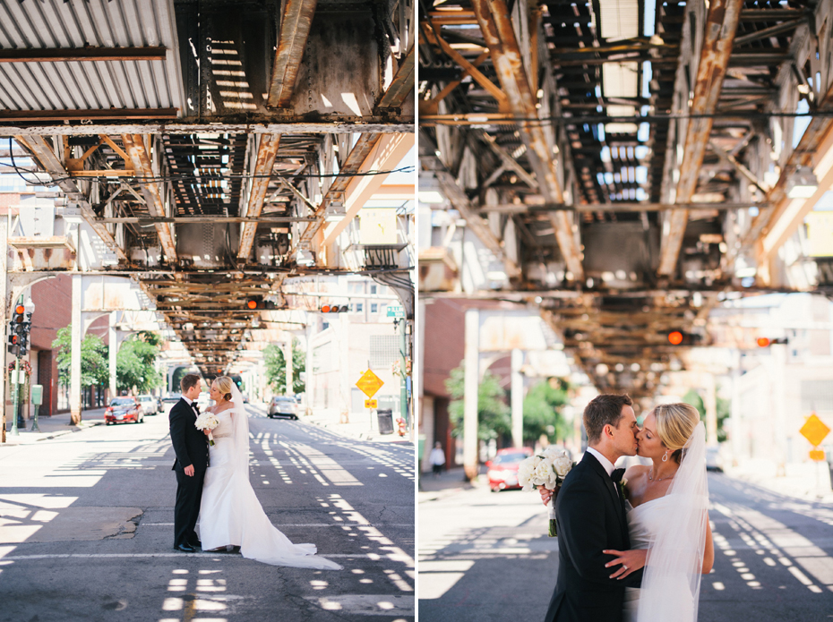 Bride and groom are photographed under the L train in Chicago, photographed by Michigan Wedding Photographer, Heather Jowett.