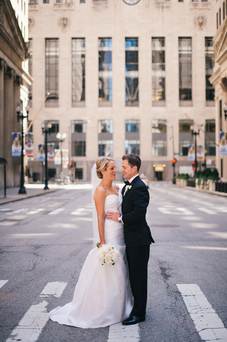 Bride and groom portraits at the board of trade in Chicago, by Michigan Wedding Photographer, Heather Jowett