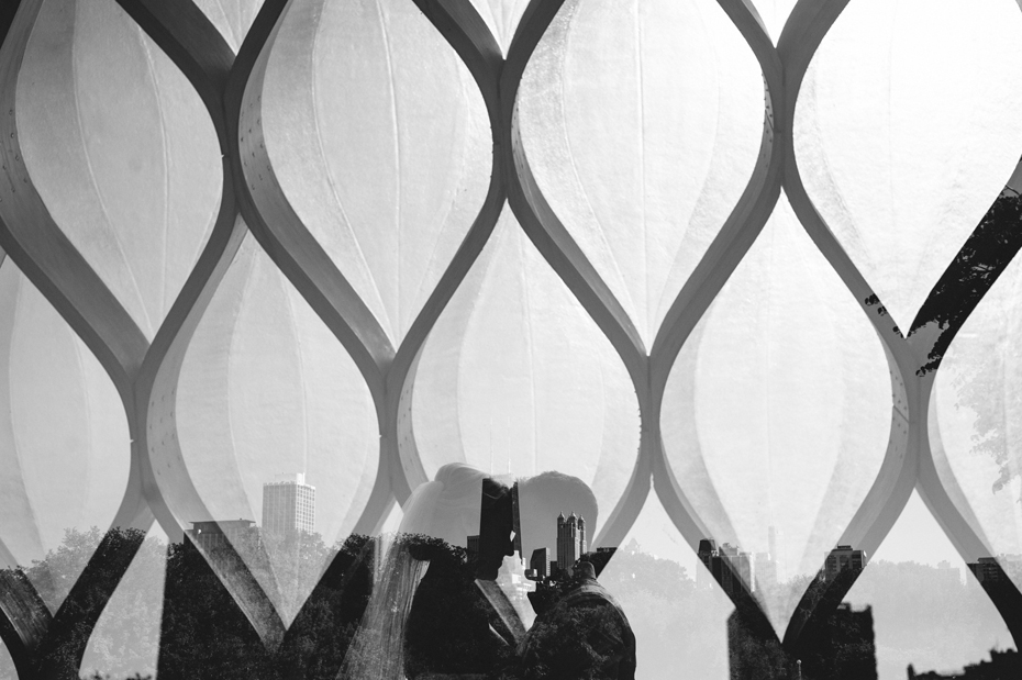 Double exposure Bride and groom portrait at the Lincoln Park Zoo with a view of the Chicago Skyline, by Michigan Wedding Photographer, Heather Jowett