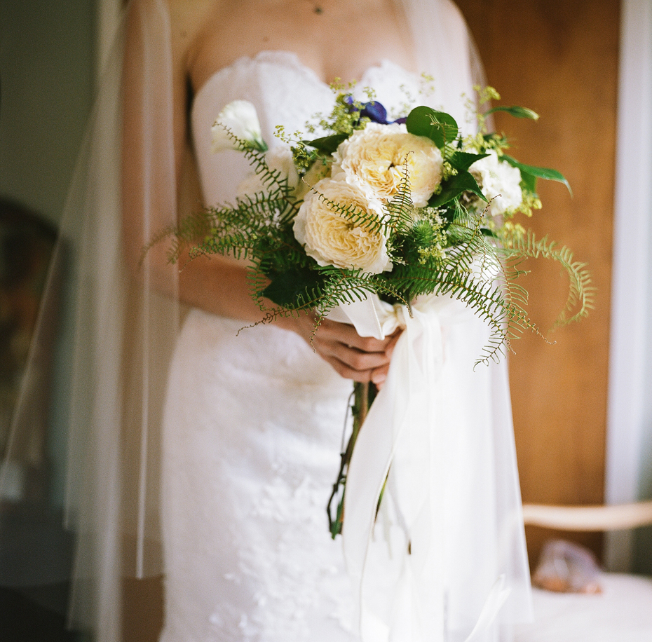 A hand tied vintage bouquet photographed on film using a vintage Rolleiflex by Ann Arbor Michigan wedding photographer, Heather Jowett.
