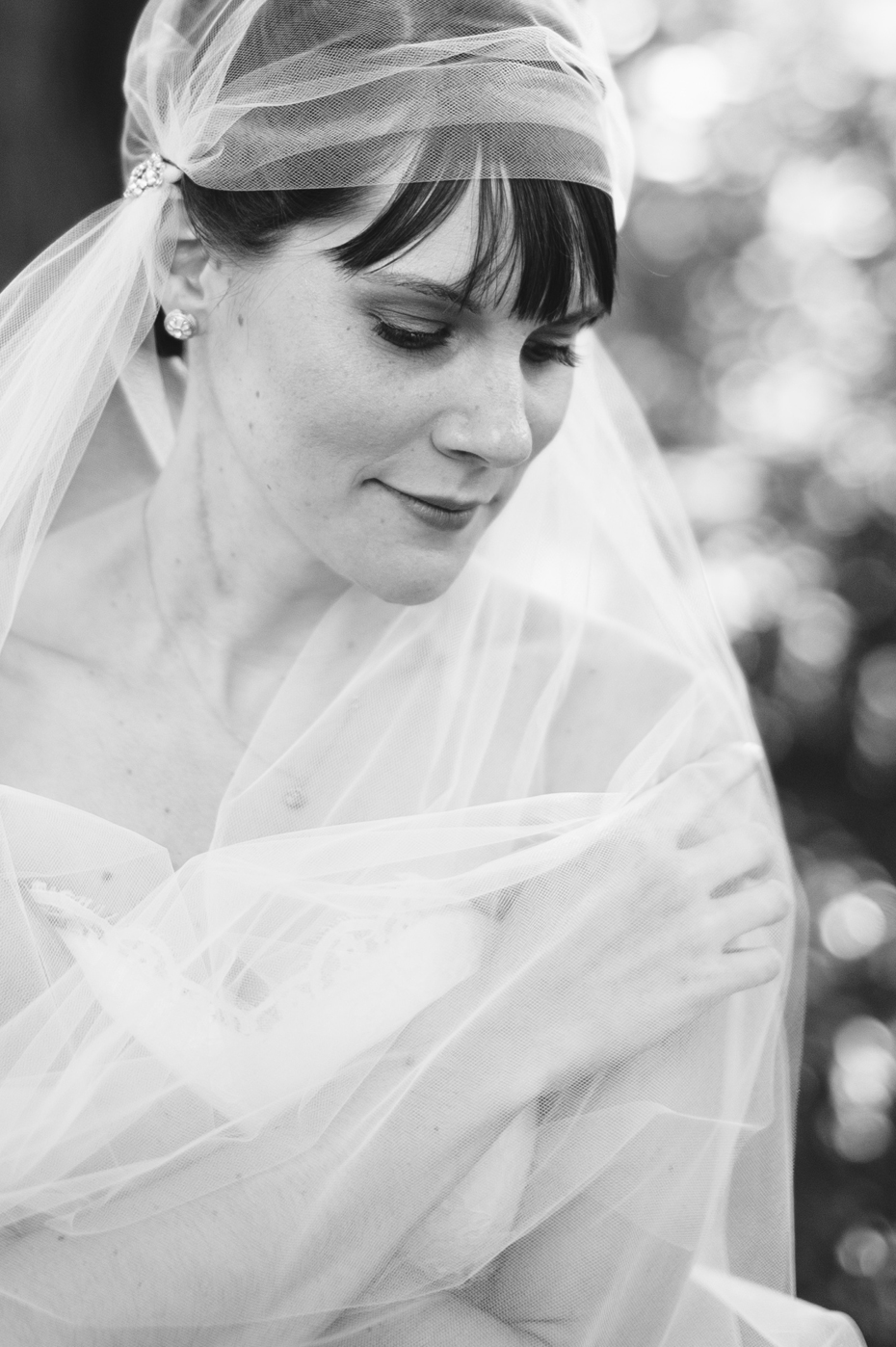 Black and white Bridal portraits with a bride wearing a vintage styled veil by Ann Arbor Michigan wedding photographer, Heather Jowett.