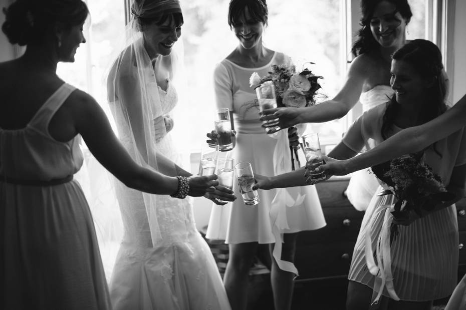 Bridesmaids toasts the bride before her wedding ceremony by Ann Arbor Michigan wedding photographer, Heather Jowett.