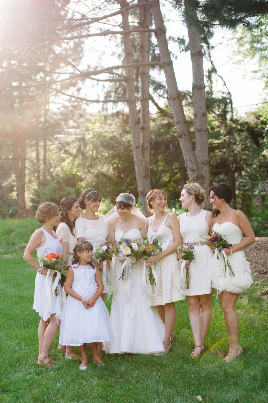 Bridesmaids with the bride and their vintage hand tied bouquets by Detroit Michigan wedding photographer, Heather Jowett.