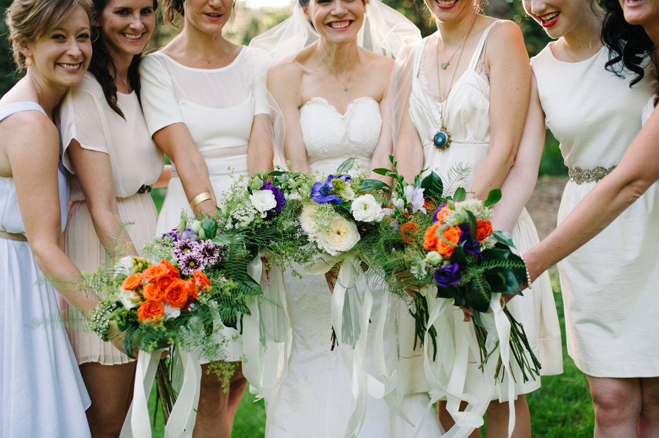Brightly colored hand tied bouquets by Detroit Michigan wedding photographer, Heather Jowett.