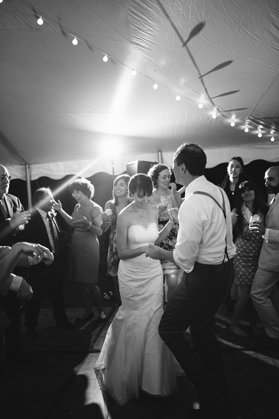 Bride and groom dancing at a backyard wedding by Bloomfield Hills wedding photographer Heather Jowett.