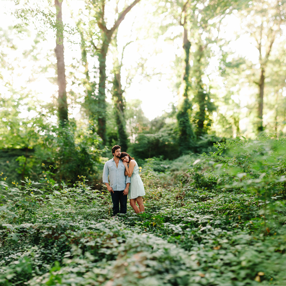 A couple embraces in the woods in this Brenizer method portrait during a Newport News Virginia engagement session by Ann Arbor Wedding Photographer Heather Jowett.