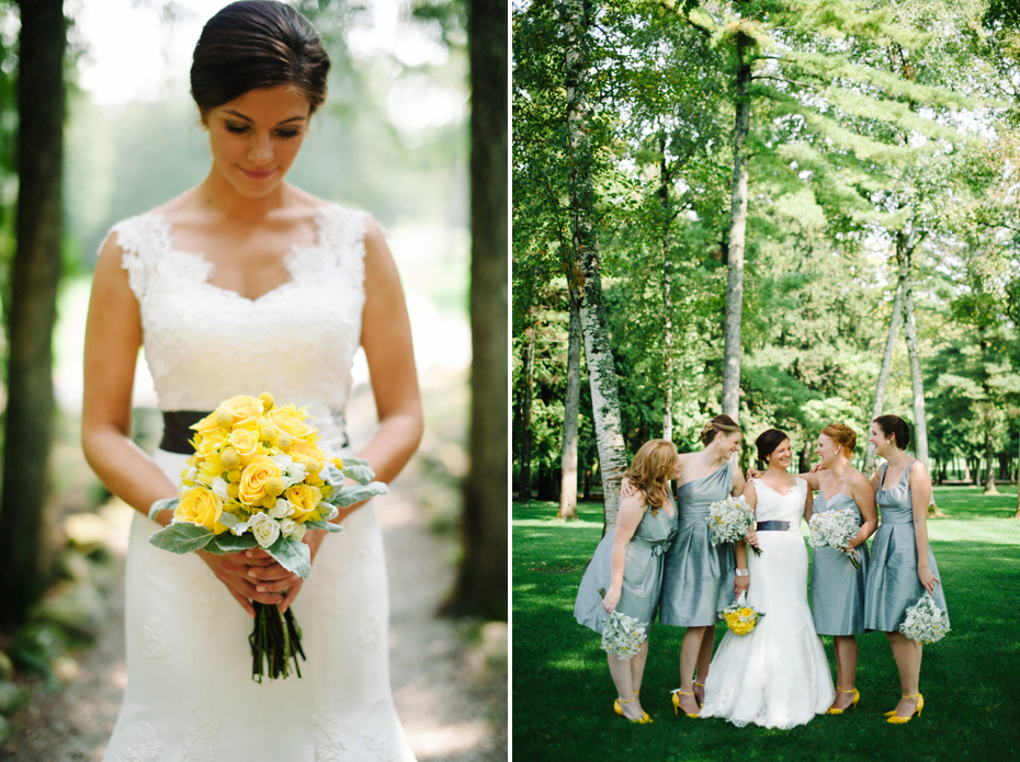 A bride holds her yellow bouquet as she and her bridesmaids pose amongst trees before her wedding at The Inn at Stonecliffe on Mackinac Island by Michigan Wedding Photographer Heather Jowett.