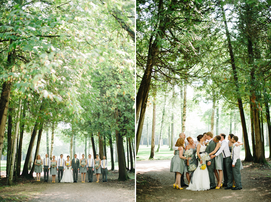 The bridal party poses amongst trees before a wedding at The Inn at Stonecliffe on Mackinac Island by Michigan Wedding Photographer Heather Jowett.