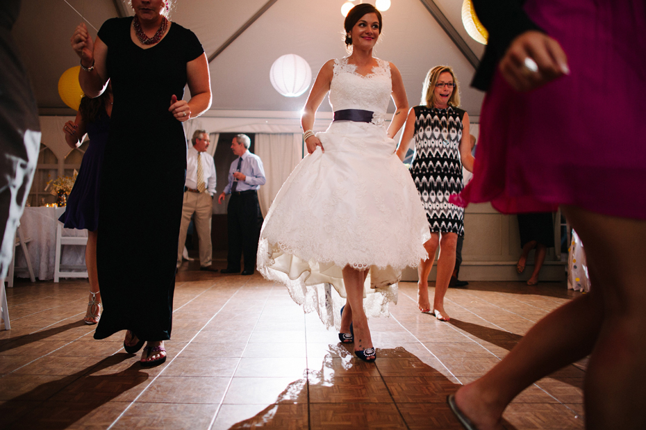 The bride dances the night away during an outdoor wedding reception at The Inn at Stonecliffe on Mackinac Island by Ann Arbor Wedding Photographer Heather Jowett.