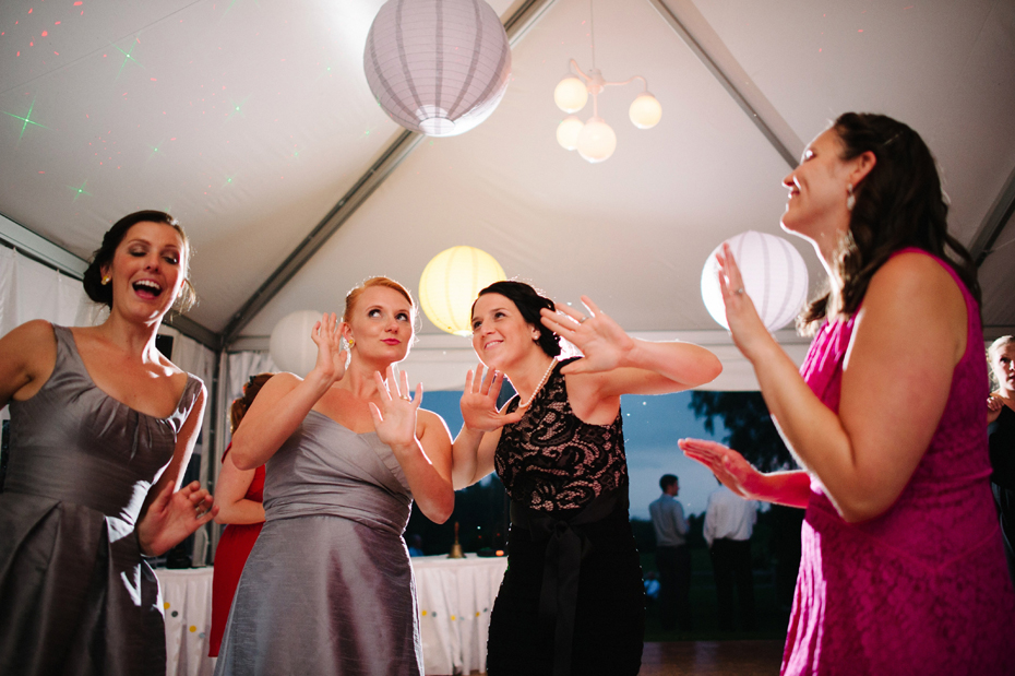 Wedding guests dancing during an outdoor wedding reception at The Inn at Stonecliffe on Mackinac Island by Ann Arbor Wedding Photographer Heather Jowett.