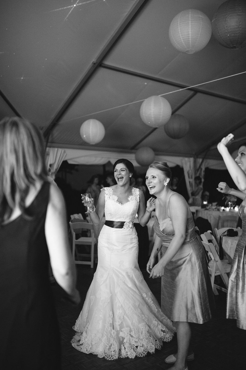 The bride dancing during an outdoor wedding reception at The Inn at Stonecliffe on Mackinac Island by Ann Arbor Wedding Photographer Heather Jowett.