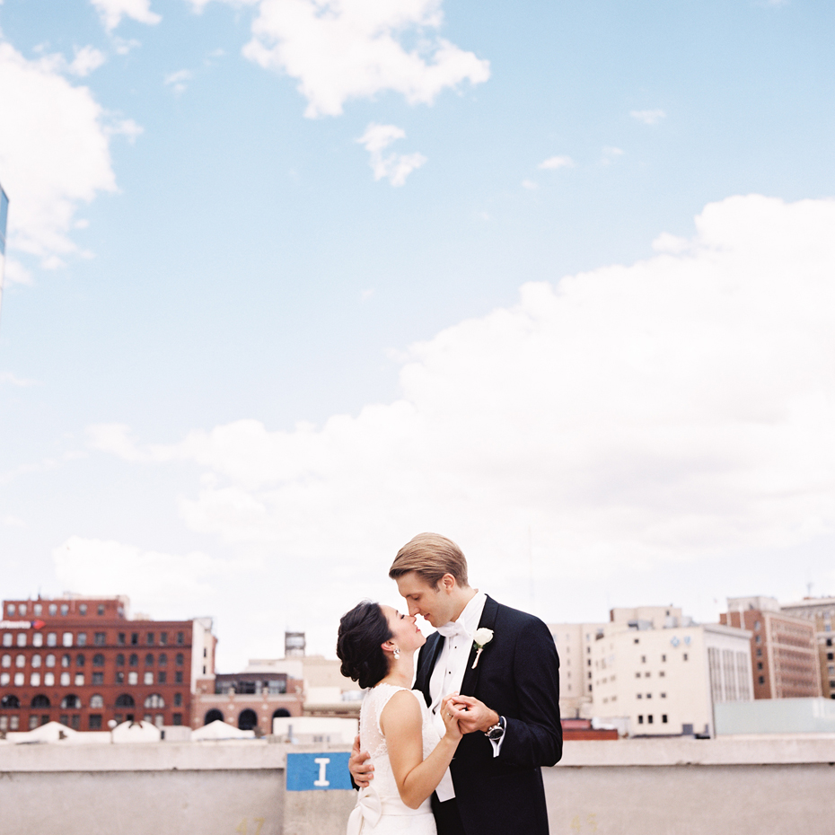 Rooftop wedding photographs with the Gand Rapids Skyline in Michigan