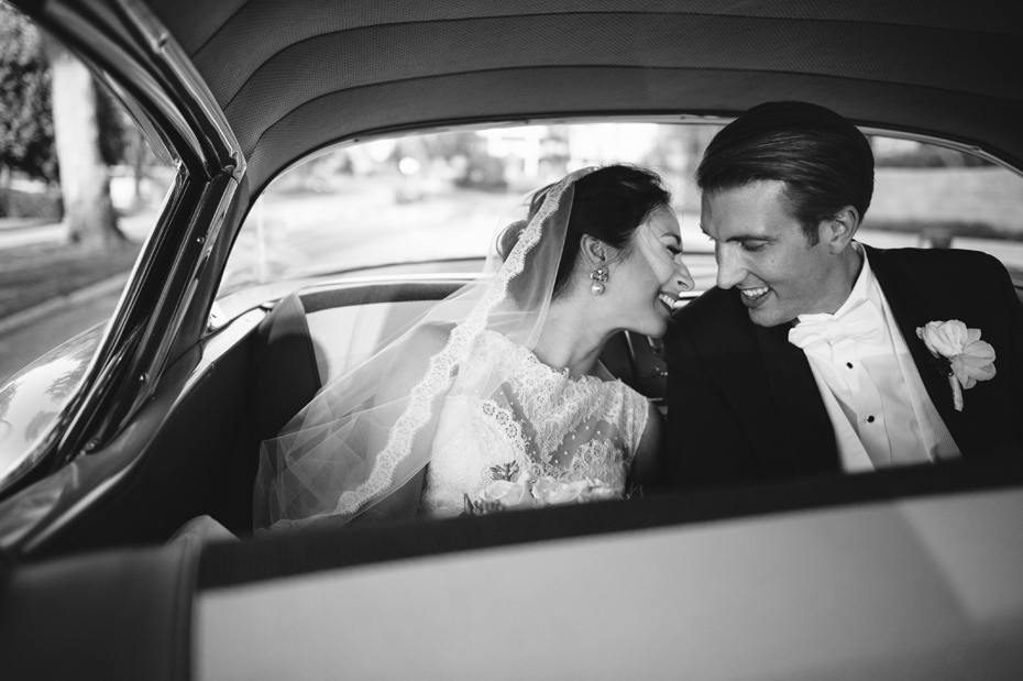 Bride and groom in a classic getaway car in Grand Rapids Michigan