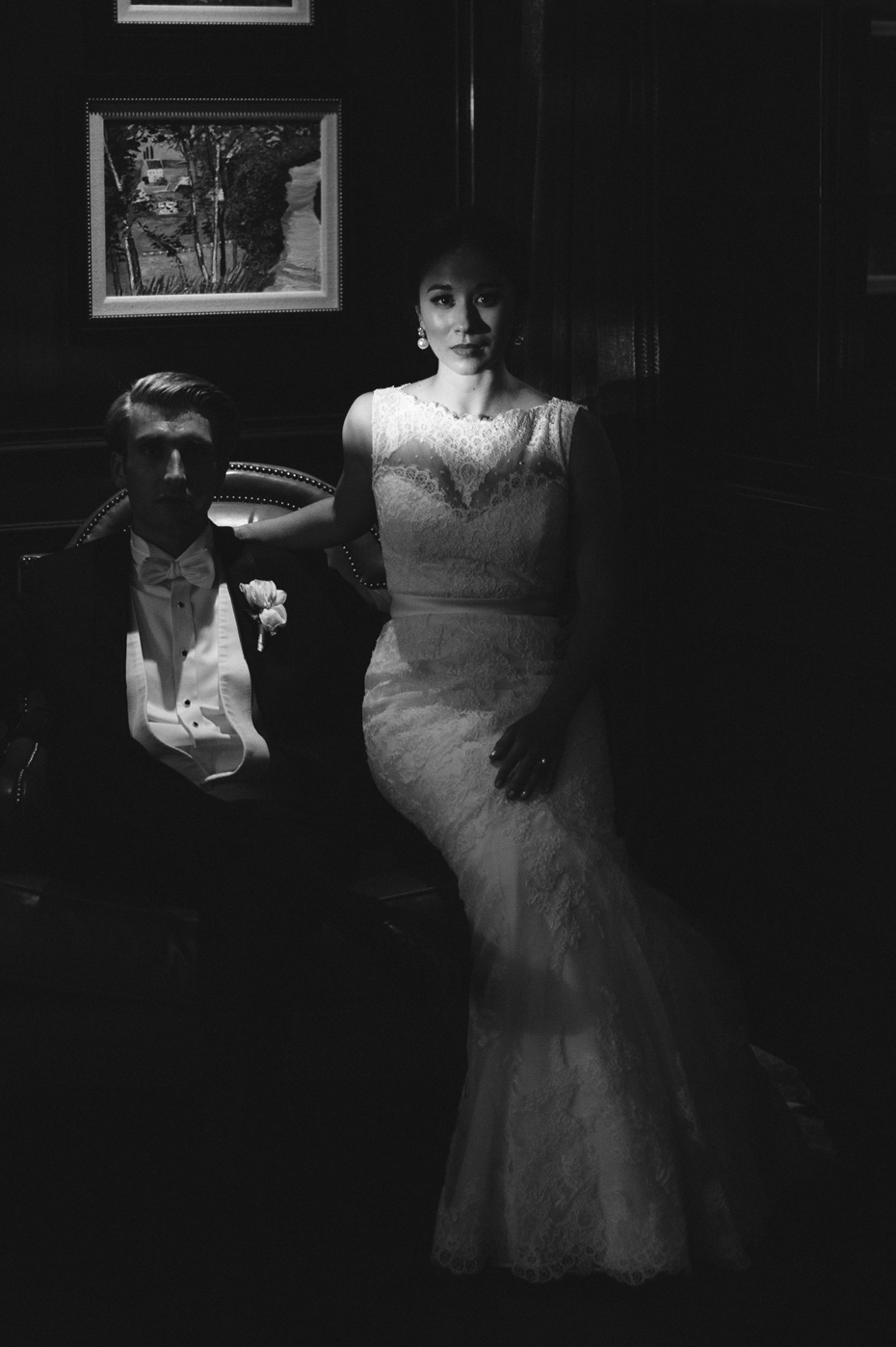 Black and white Photograph of bride and groom in bar at Amway Grand in Grand Rapids Michigan