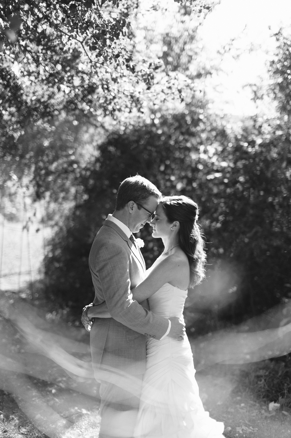 Black and white bride and groom portrait at Misty Farms by photojournalistic Michigan wedding photographer Heather Jowett.