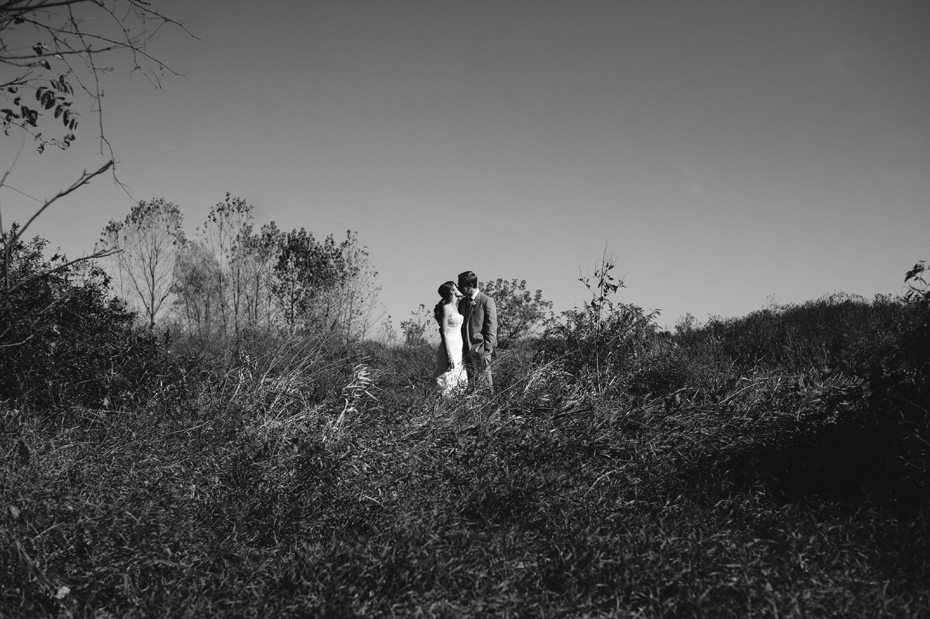 Black and white bride and groom portrait at Misty Farms by photojournalistic Michigan wedding photographer Heather Jowett.