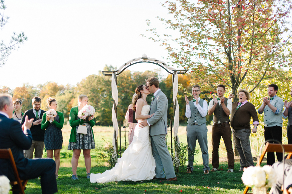 Bride and groom share their first kiss at Misty Farms in Ann Arbor Michigan.