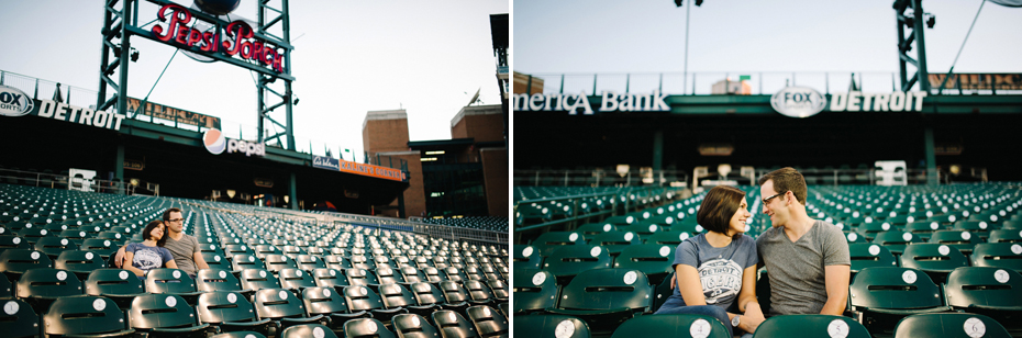 A couple posing in their season ticket seats during their Tigers Baseball themed engagement session at Comerica Park.