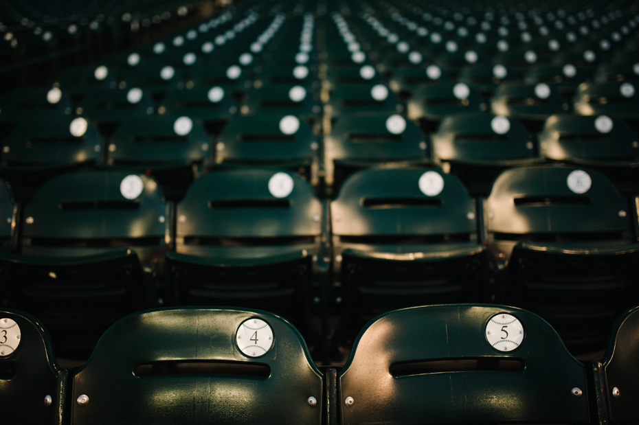 Lauren and Jeffs Season ticket seats during their Tigers Baseball themed engagement session at Comerica Park.
