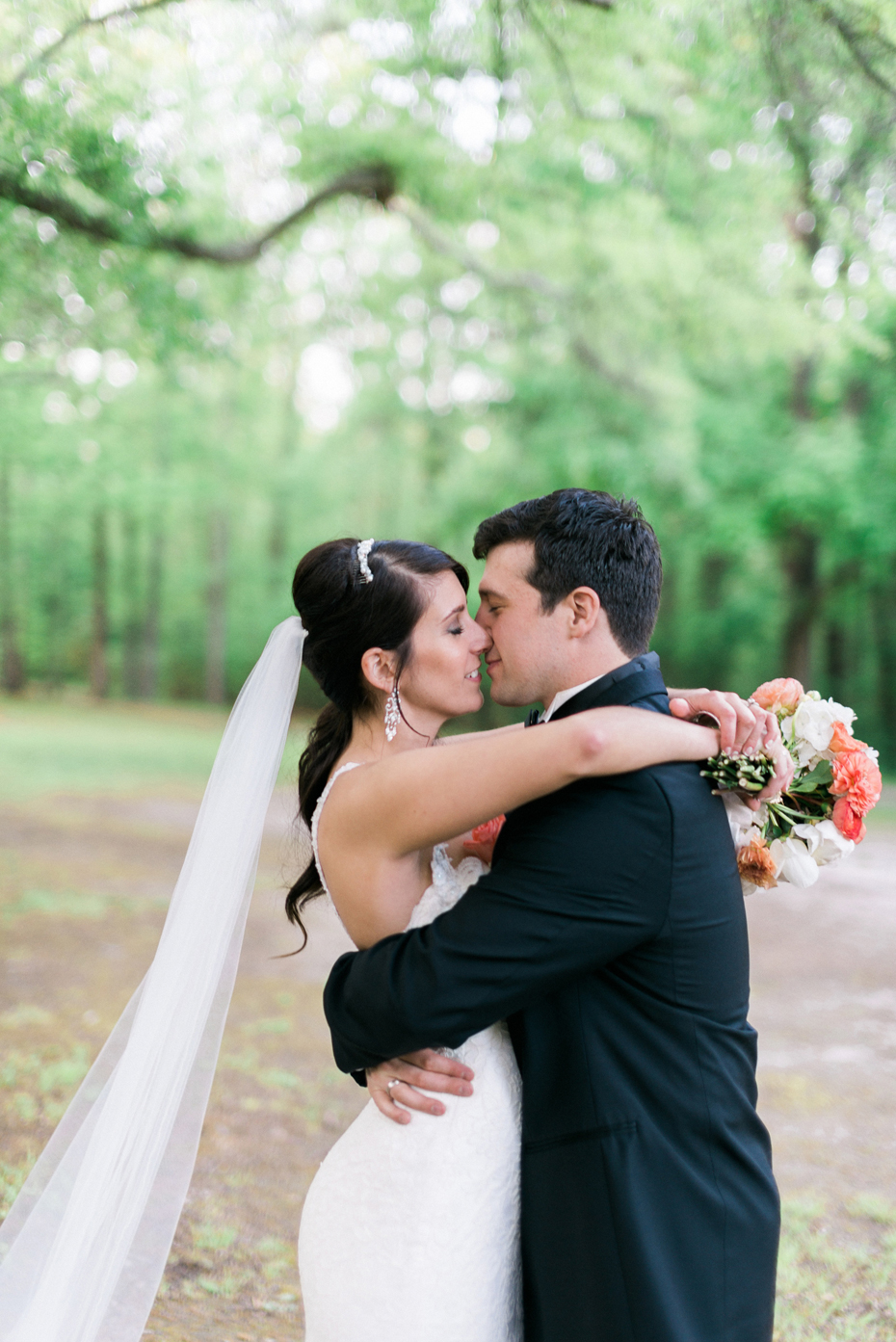 Bride and groom share a kiss at the Noland Trail by Virginia Wedding Photographer, Heather Jowett.