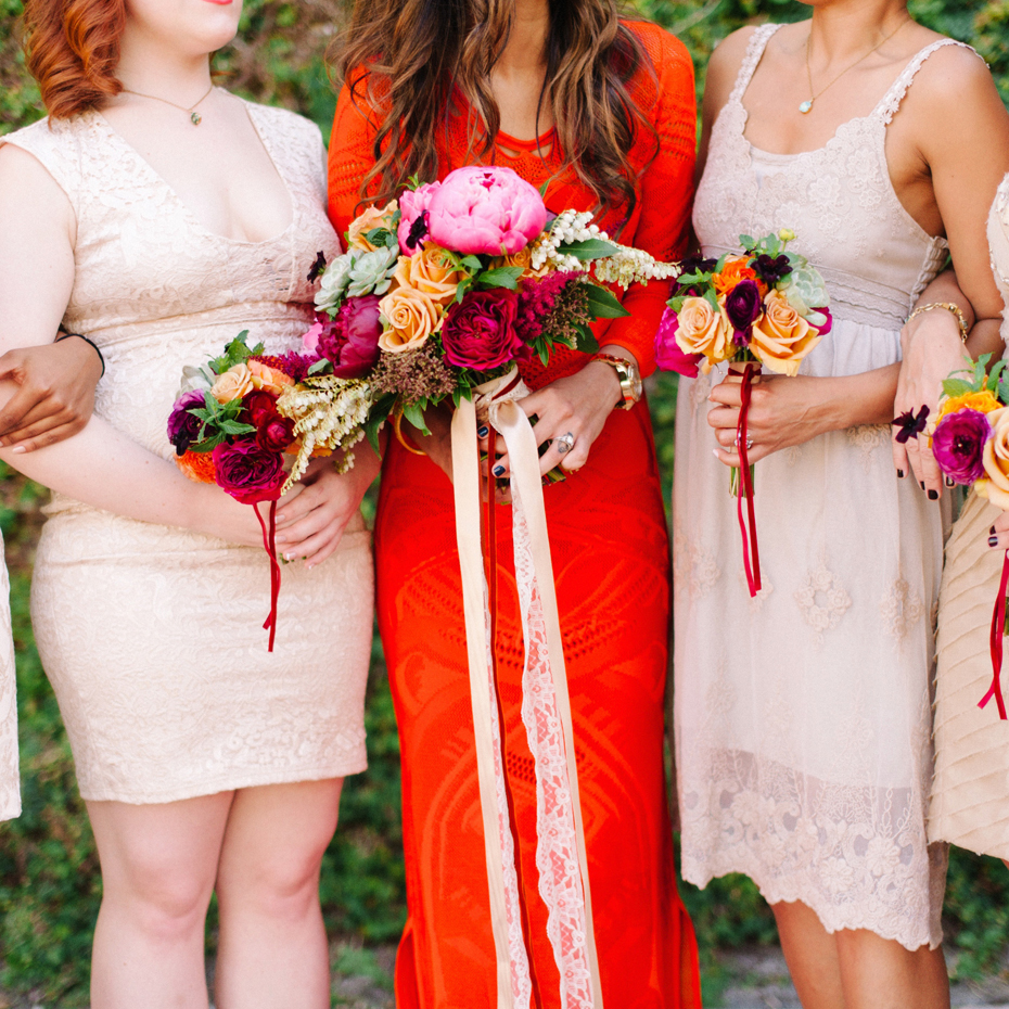 Brightly colored florals in jewel tones at the Sundy house in southern florida by wedding photographer Heather Jowett.