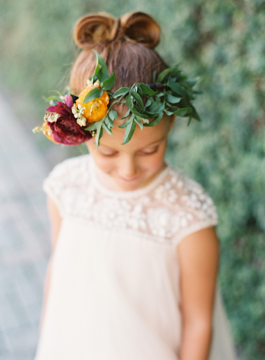 Floral girl in floral crown at the Sundy house in southern florida by wedding photographer Heather Jowett.