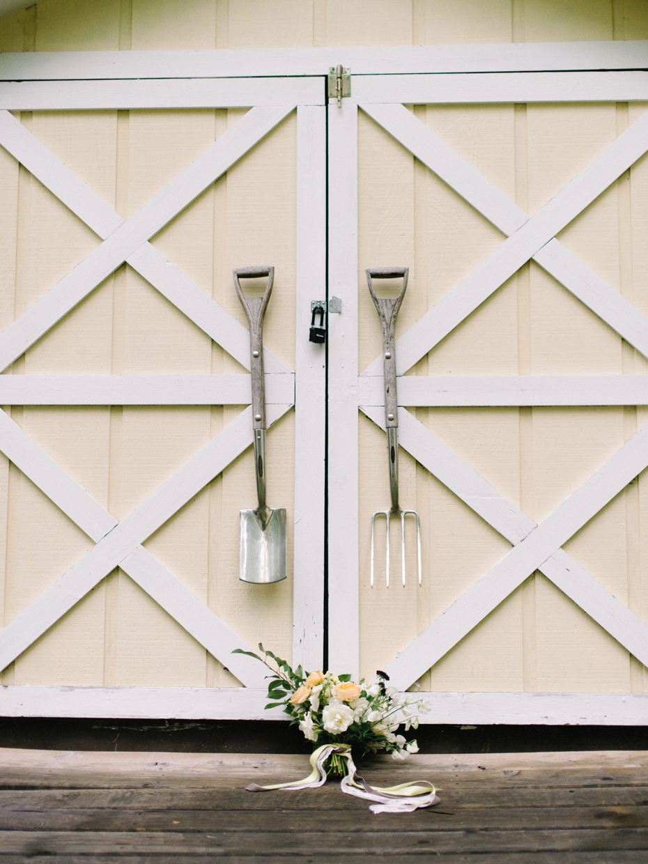 Yellow white khaki rustic wedding bouquet by Katie Wachowiak and photographed by Heather Jowett.