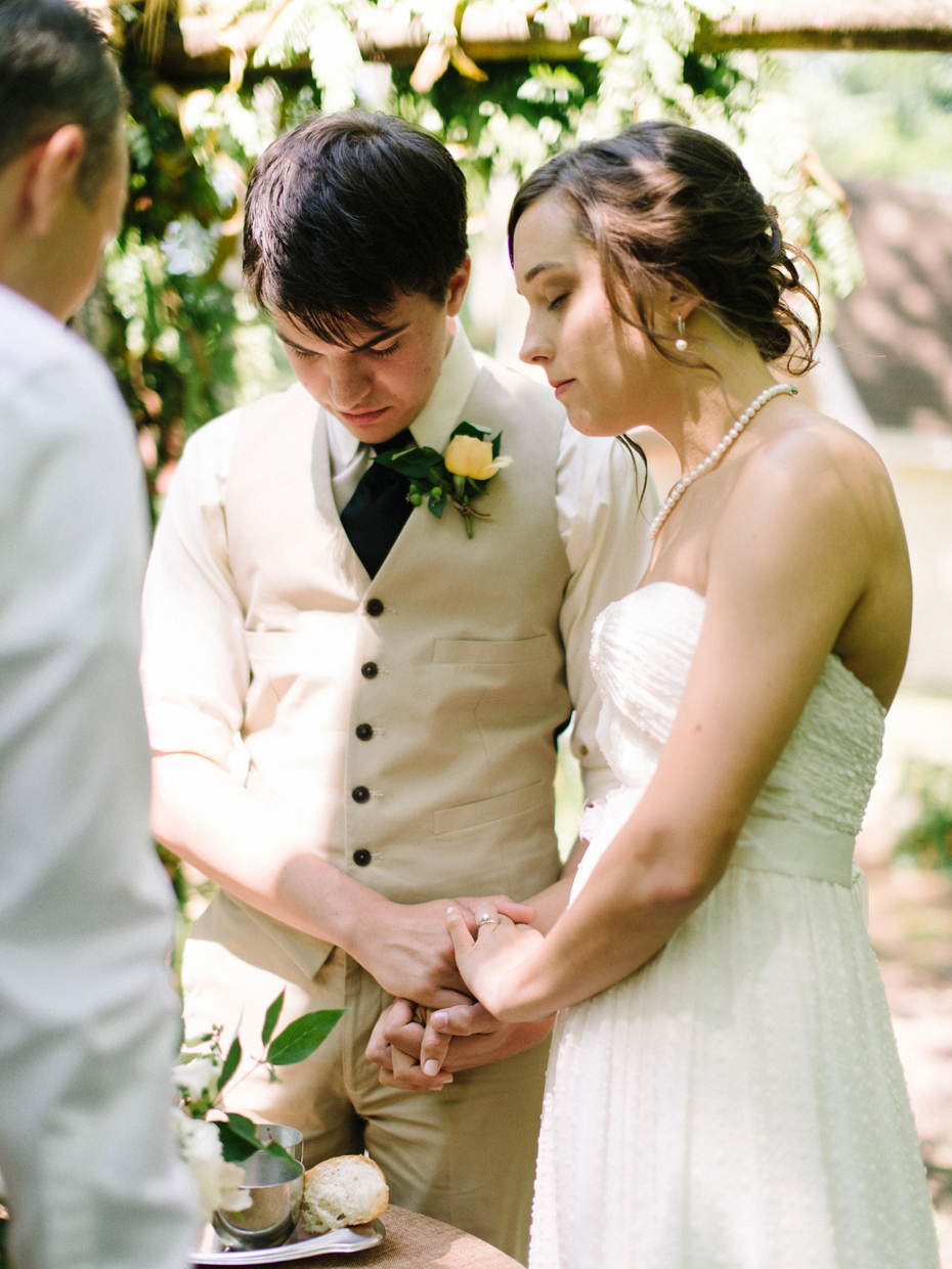 Communion during a rustic wooded wedding ceremony in Northern Michigan.