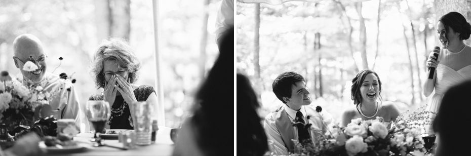 Bride and groom laughing at toasts at a rustic yellow and white wedding.