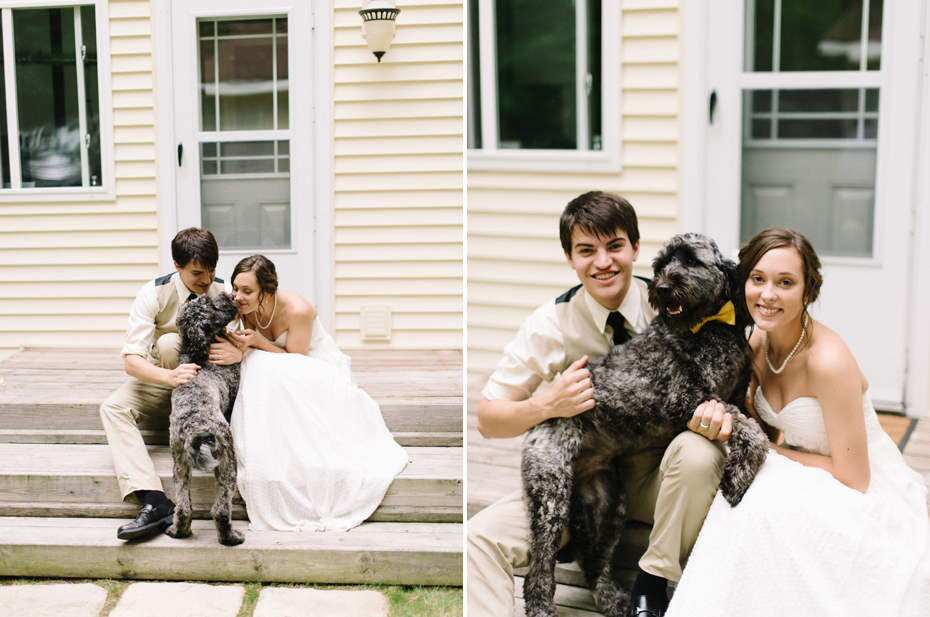 Bride and groom pose with their dog.