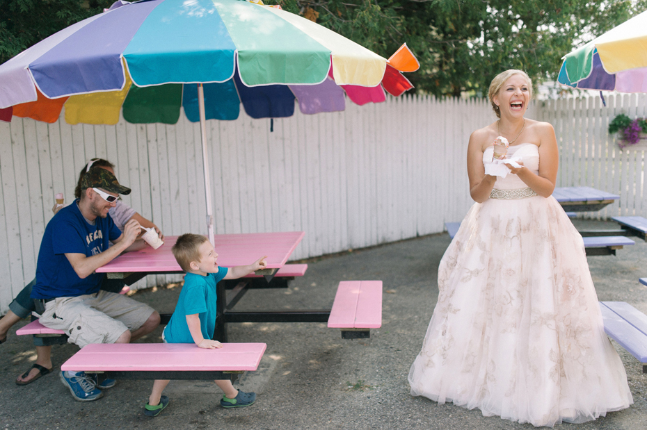 The bride and her bridesmaids stop for ice-cream in East Jordan before her wedding at Tapawingo in Northern Michigan, by Ann Arbor Wedding Photographer Heather Jowett.