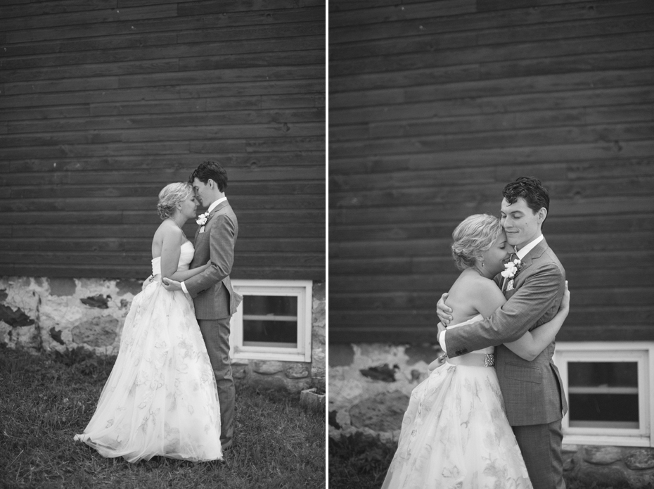 The bride and groom share their first look by a barn before their wedding at Tapawingo in Northern Michigan, by Ann Arbor Wedding Photographer Heather Jowett.