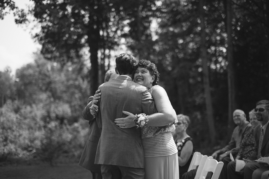 The groom hugs his mother just before his wedding ceremony at Tapawingo in Norther Michigan.